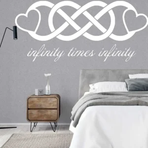 Double Infinity Wall Sticker in black above a modern bedroom bed, infinity love hearts vinyl wall decal design