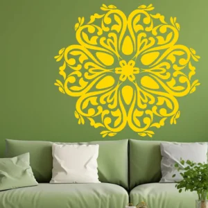 Moroccan Filigree Wall Sticker in Golden Yellow, Intricate Floral Mandala Design Centered Above a Green Sofa on a Sage Green Wall.