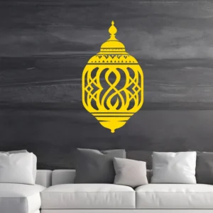 Golden Moroccan Lantern Wall Sticker with Geometric Cutouts on a Dark Black Wall Above a Light Grey Sofa.