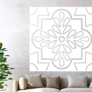 Light Gray Quatrefoil Rosette Wall Sticker on a White Square Panel Above a Beige Sofa on a Pale Gray Wall, with a Green Plant on the Left.