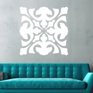 White Moroccan Fleur Wall Sticker on a Textured Gray Wall Above a Teal Sofa.