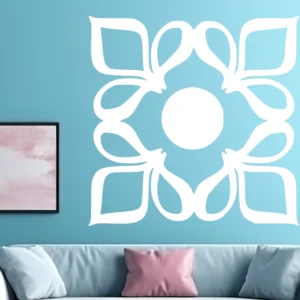White Moroccan Four-petal Wall Sticker on a Teal Wall Above a Light Blue Sofa with Pink and Grey Cushions.