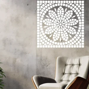 White Mosaic Rosette Wall Sticker on a Concrete Wall Above a White Lounge Chair with a Plant Nearby.
