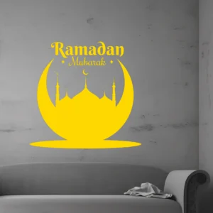 Yellow Ramadan Crescent Wall Sticker on a Gray Concrete Wall, Showing “ramadan Mubarak” with a Mosque Silhouette Inside a Crescent Above a Sofa.