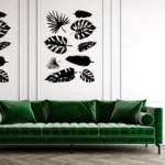 Black Tropical Leaf Wall Sticker Set Arranged Above a Green Sofa on a White Panelled Wall | Stickers on Wall