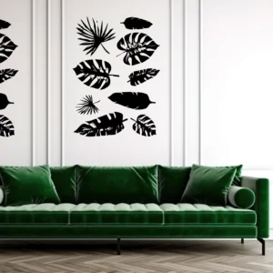 Black Tropical Leaf Wall Sticker Set Arranged Above a Green Sofa on a White Panelled Wall