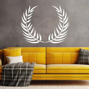 Laurel Wreath Wall Sticker in White Above a Yellow Sofa on a Grey Textured Wall
