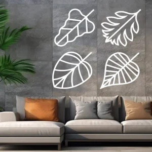 Leaf Outline Wall Sticker Set of Four Modern Botanical Line Art Leaves Displayed Above a Neutral Sectional Sofa on a Grey Wall.