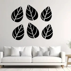 Minimal Leaf Set Wall Sticker (6 Pieces) in Black on a Light Wall Above a Modern White Sofa