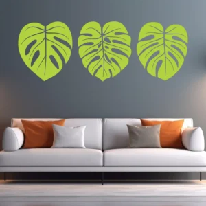 Monstera Leaf Wall Sticker Trio in Green Above Modern White Sofa on Grey Wall