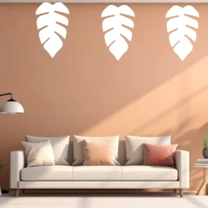 Three Monstera Jungle Leaf Wall Stickers on a Warm Peach Wall Above a Modern Sofa in a Minimalist Living Room