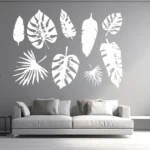 White Tropical Leaf Wall Sticker Set with Monstera and Palm Leaves Arranged Above a Sofa on a Grey Wall | Stickers on Wall