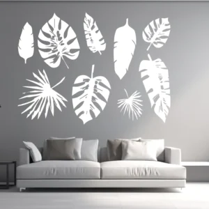 White Tropical Leaf Wall Sticker Set with Monstera and Palm Leaves Arranged Above a Sofa on a Grey Wall