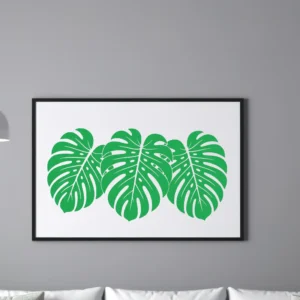 Oversized Monstera Wall Sticker Artwork in Green Displayed in Black Frame Above Modern Sofa