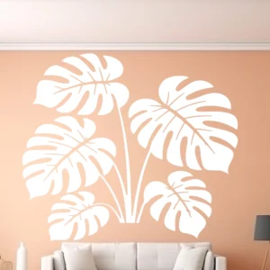 White Monstera Leaf Cluster Wall Sticker on Warm Peach Wall Above Sofa